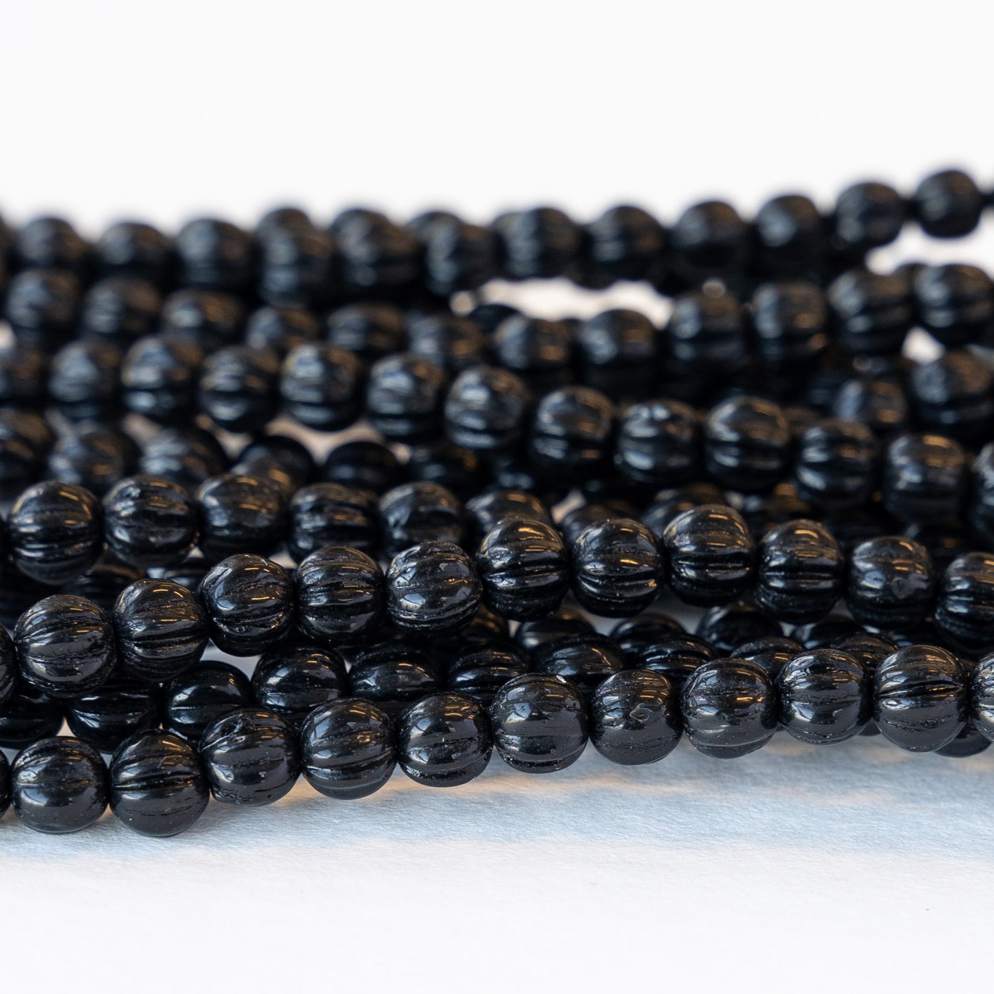 Load image into Gallery viewer, 5mm Melon Beads - Black - 48 Beads
