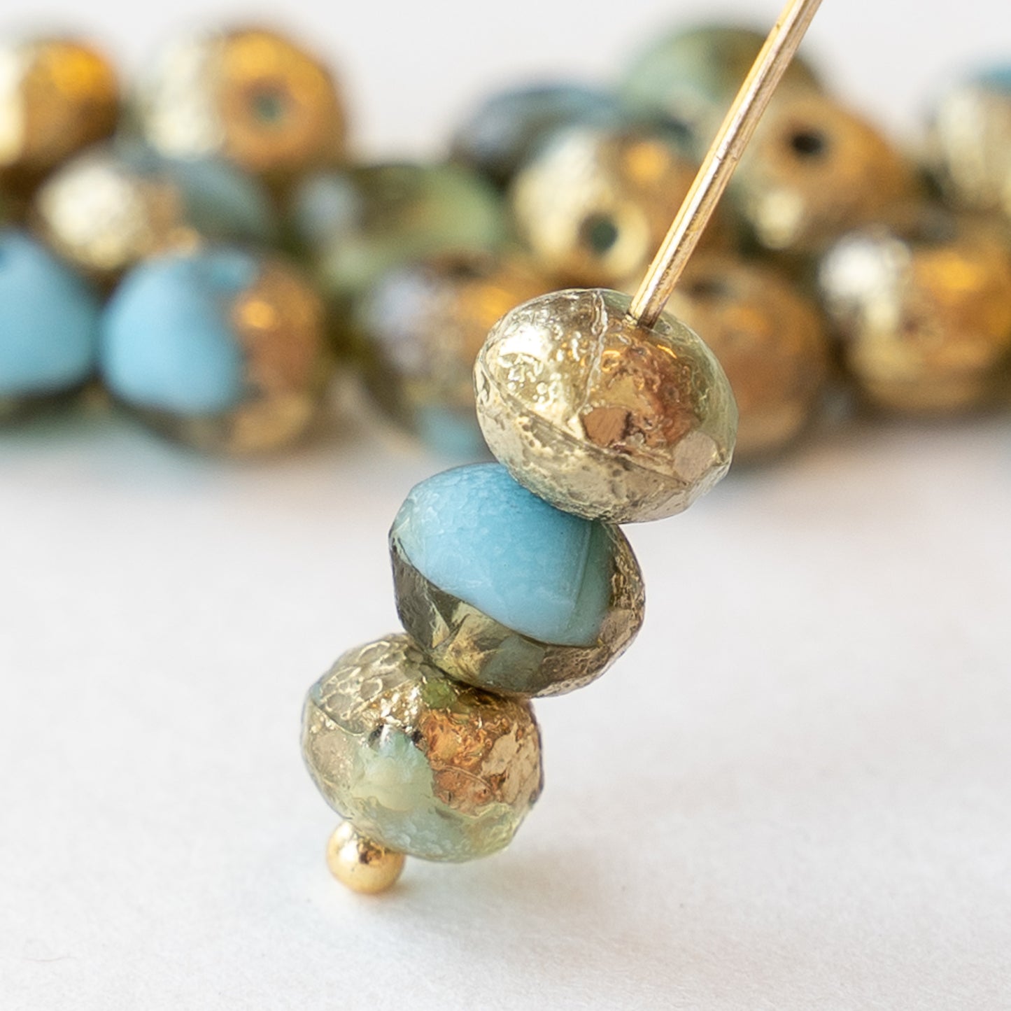 Load image into Gallery viewer, 5x7mm Rondelle Beads - Blue with Gold Etched Finish - 25 beads
