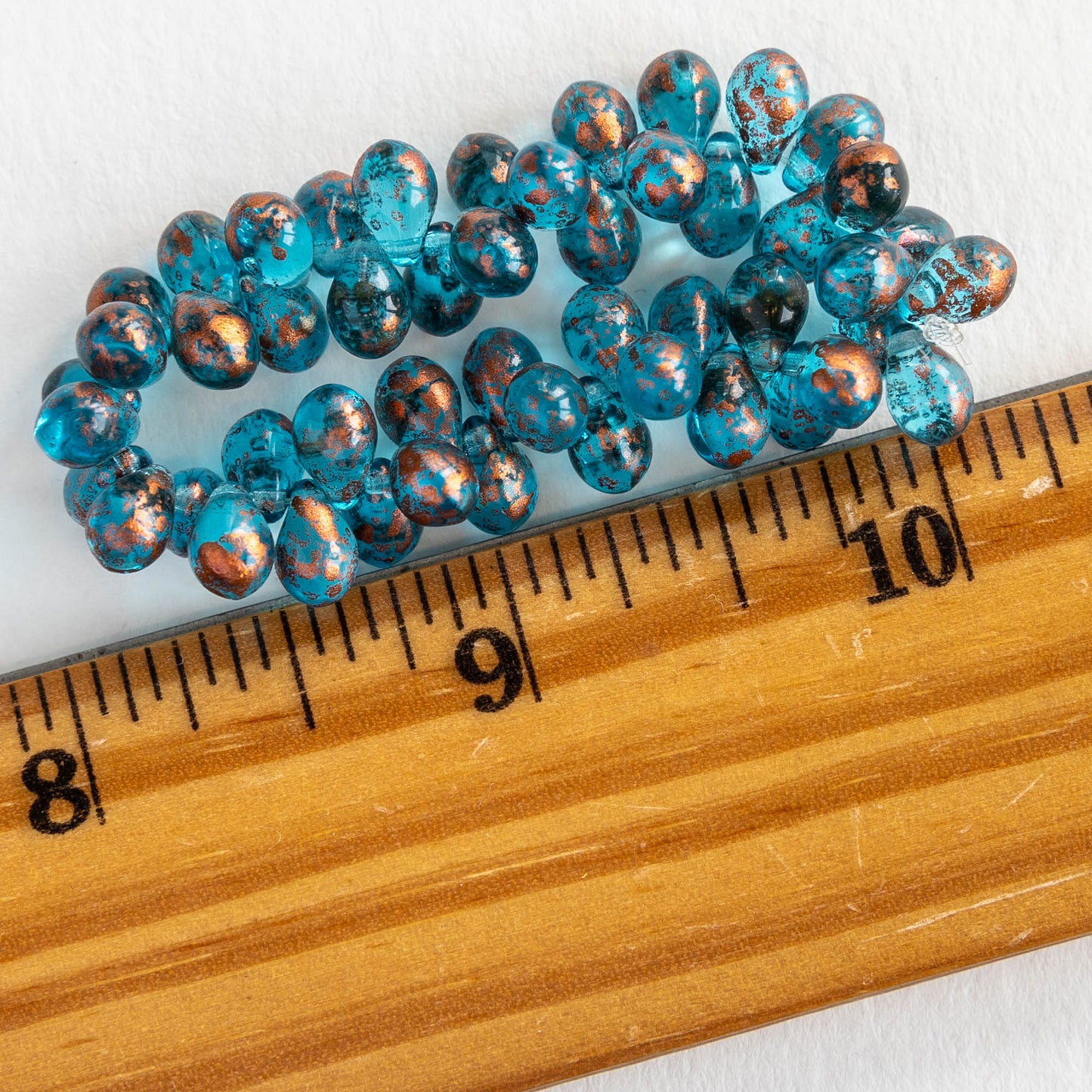 Load image into Gallery viewer, 5x7mm Teardrop Beads - Capri Blue with Copper - 50 Beads
