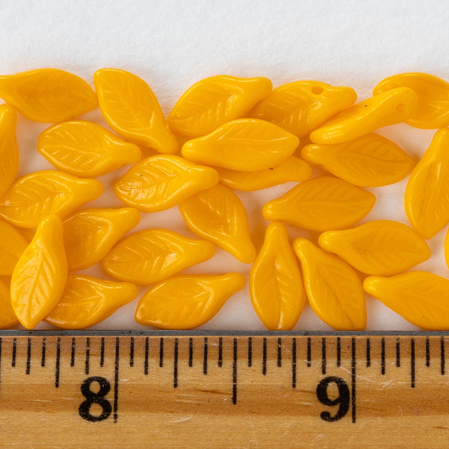 Load image into Gallery viewer, 6x12mm Glass Leaf Beads - Opaque Sunflower Yellow - 30 beads
