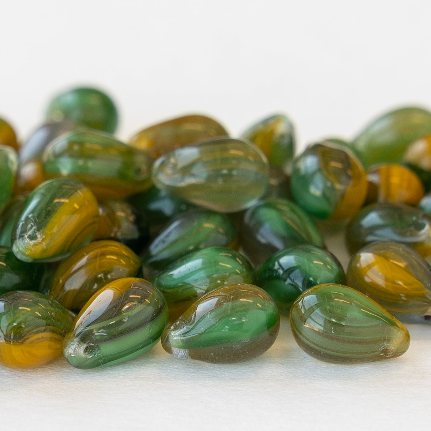 Load image into Gallery viewer, 6x9mm Glass Teardrop Beads -  Green and Amber Striped Mix - 60 Beads
