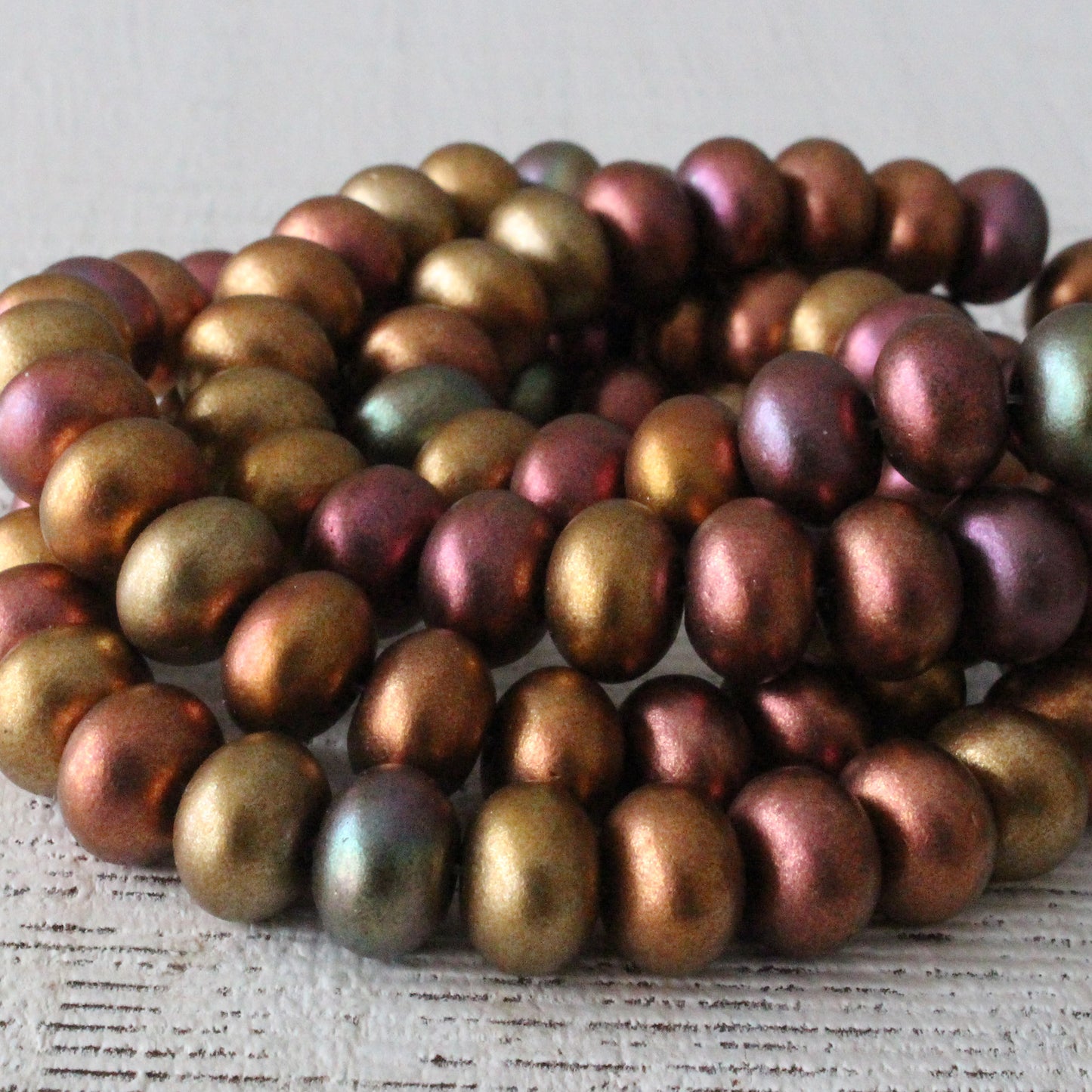Load image into Gallery viewer, 6x9mm Smooth Rondelle - Gold Iris Matte - 25 Beads
