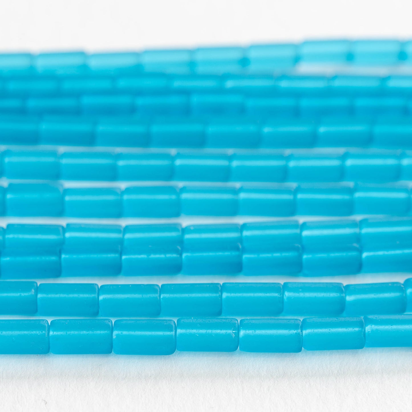Load image into Gallery viewer, 9x4mm Frosted Glass Tube Beads - Aqua - 48 Beads
