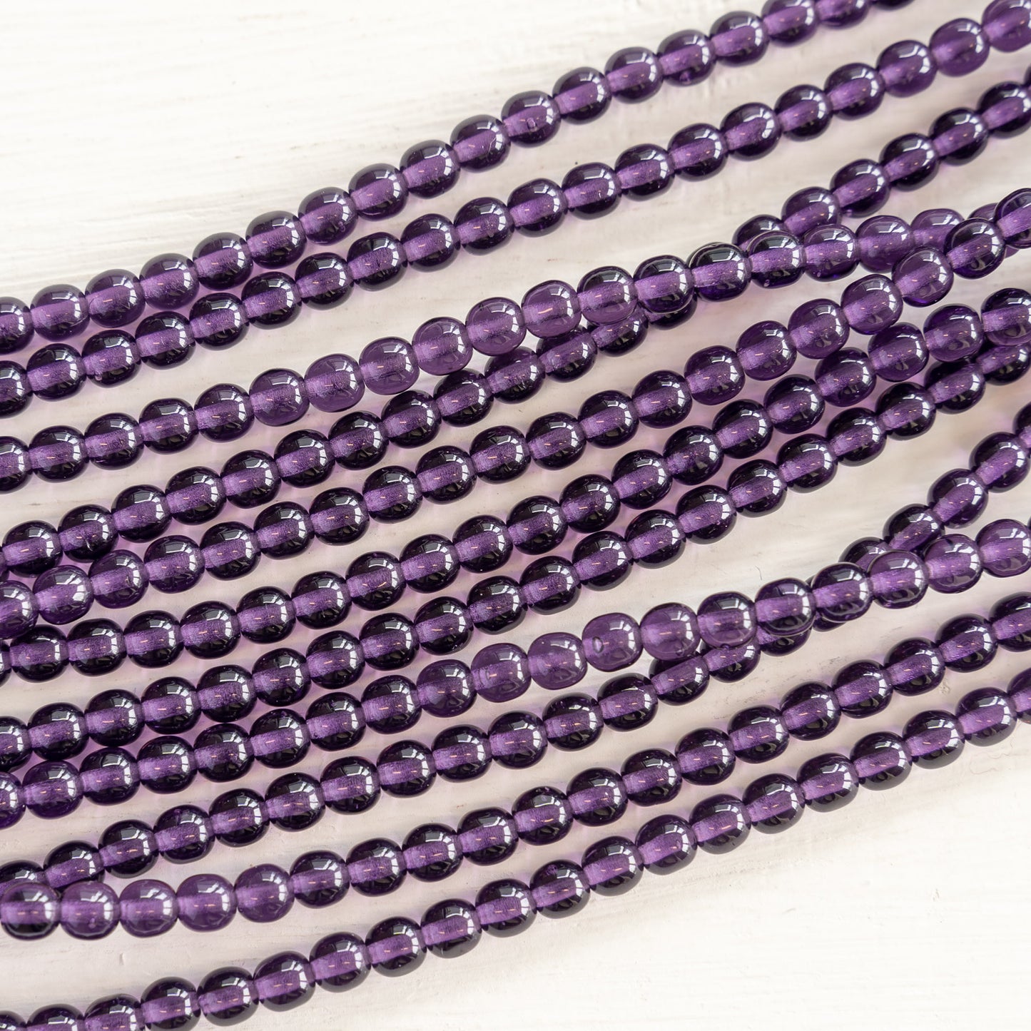 Load image into Gallery viewer, 4mm Round Glass Beads - Purple Tanzanite - 100 Beads
