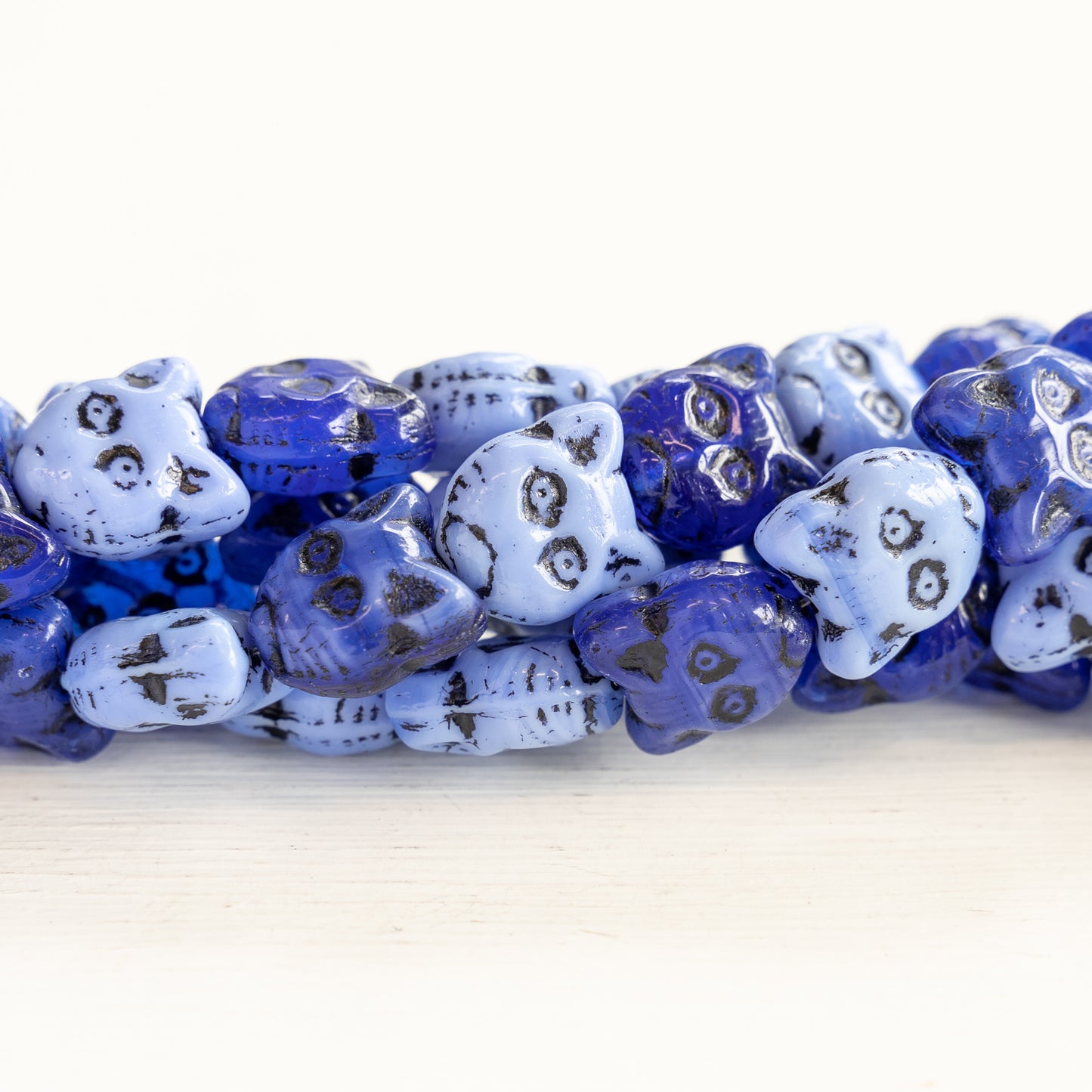 Load image into Gallery viewer, 12mm Glass Cat Beads - Blue Mix with Black Wash - 10 Beads
