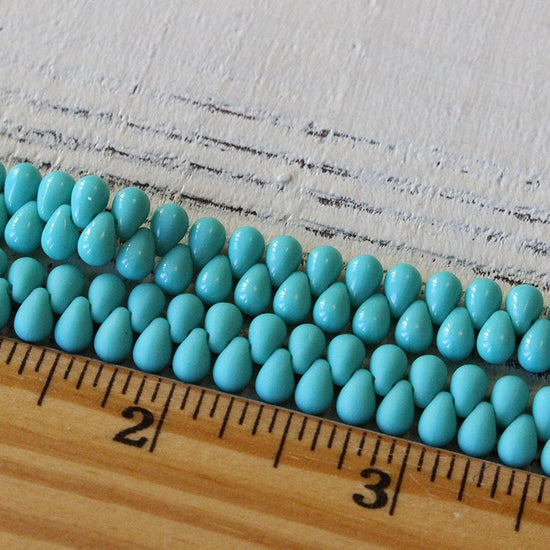 Load image into Gallery viewer, 4x6mm Glass Teardrop Beads - Turquoise - 100 Beads
