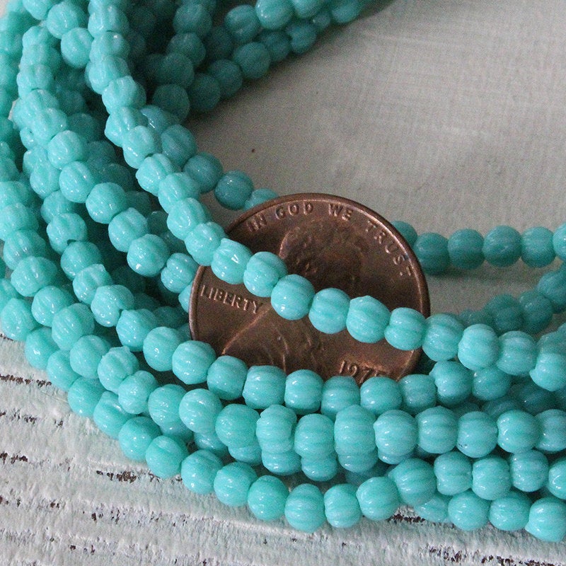 Load image into Gallery viewer, 3mm Melon Beads - Opaque Turquoise - 100 Beads

