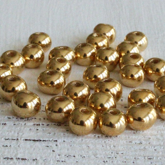 Load image into Gallery viewer, 6-7mm 24K Gold Coated Ceramic Round Beads - Gold
