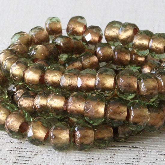Load image into Gallery viewer, 6x9mm Roller Beads  - Copper Lined Peridot - Choose Amount
