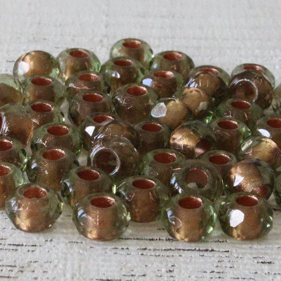Load image into Gallery viewer, 6x9mm Roller Beads  - Copper Lined Peridot - Choose Amount
