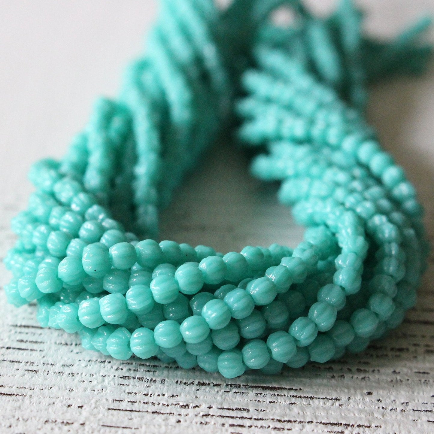 Load image into Gallery viewer, 3mm Melon Beads - Opaque Turquoise - 100 Beads
