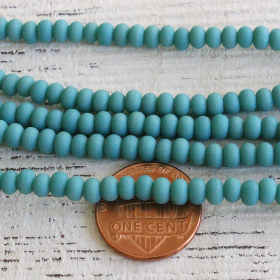 Load image into Gallery viewer, 3x4mm Frosted Frosted Glass Rondelle Beads - Opaque Turquoise - 16 inches
