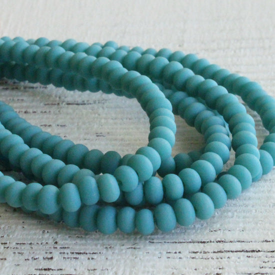 Load image into Gallery viewer, 3x4mm Frosted Frosted Glass Rondelle Beads - Opaque Turquoise - 16 inches
