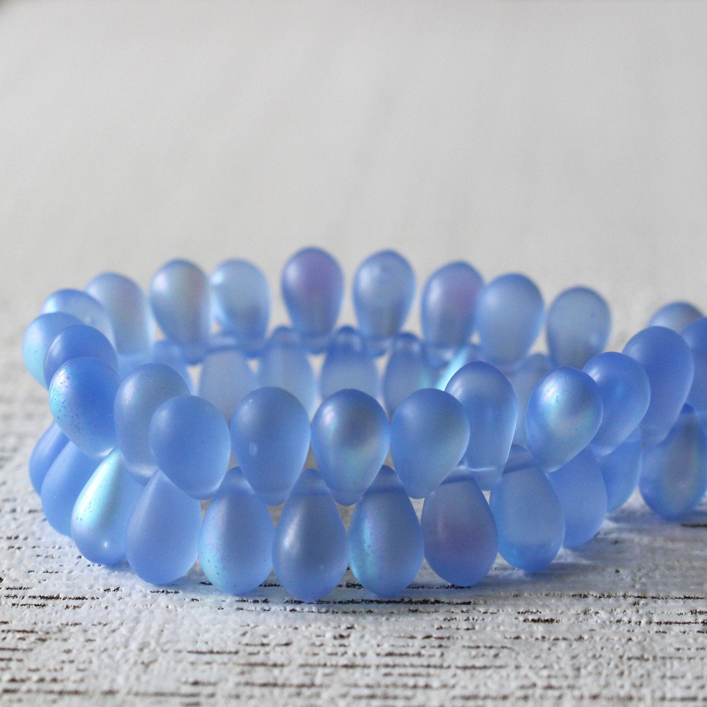 Load image into Gallery viewer, 6x9mm Glass Teardrop Beads - Matte Sky Blue AB - 50 Beads

