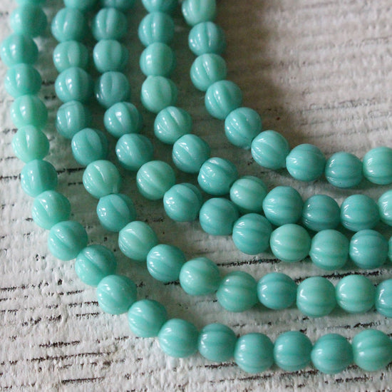 Load image into Gallery viewer, 4mm Melon Beads - Opaque Turquoise - 56 Beads
