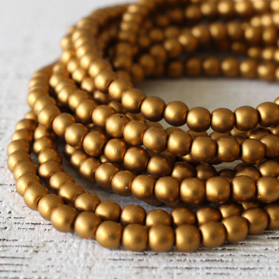 Load image into Gallery viewer, 4mm Round Glass Beads - Frosted Gold Matte - 100 beads
