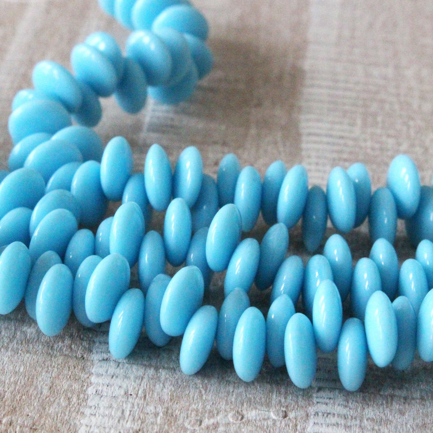 Load image into Gallery viewer, 8mm Glass Lentil Beads - Opaque Baby Blue - 50 Beads
