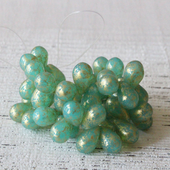 Load image into Gallery viewer, 6x9mm Glass Teardrop Beads - Seafoam Gold Dust - 25 Beads
