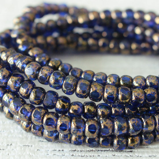 Load image into Gallery viewer, Size 6/0 Trica Seed Beads - Sapphire with Gold - 50 beads
