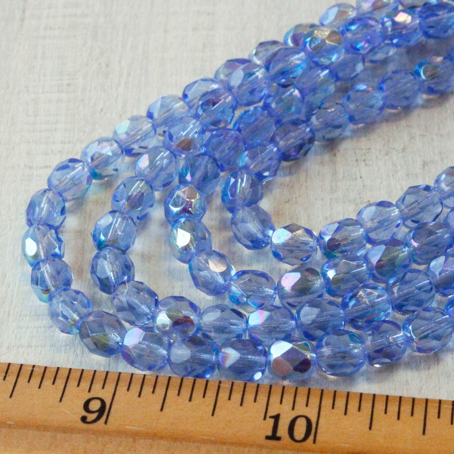 Load image into Gallery viewer, 6mm Firepolished Round Glass Beads - Sapphire Blue AB - 50 Beads
