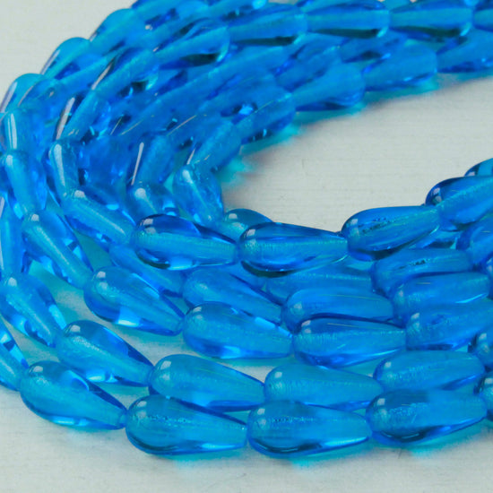 Load image into Gallery viewer, 6x12mm Long Drilled Drops - Deep Sea Aqua - 20 Beads
