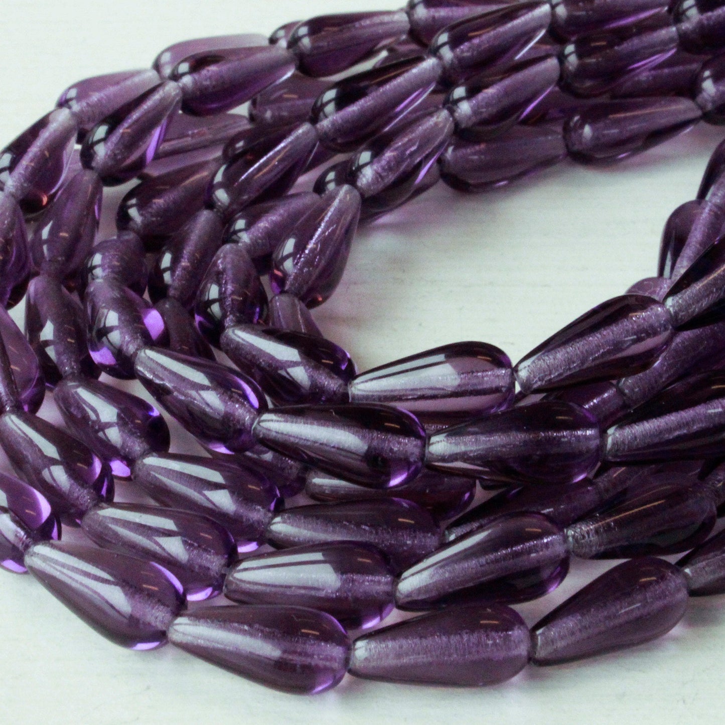 Load image into Gallery viewer, 6x12m Long Drilled Drops - Tanzanite Purple - 20 Beads
