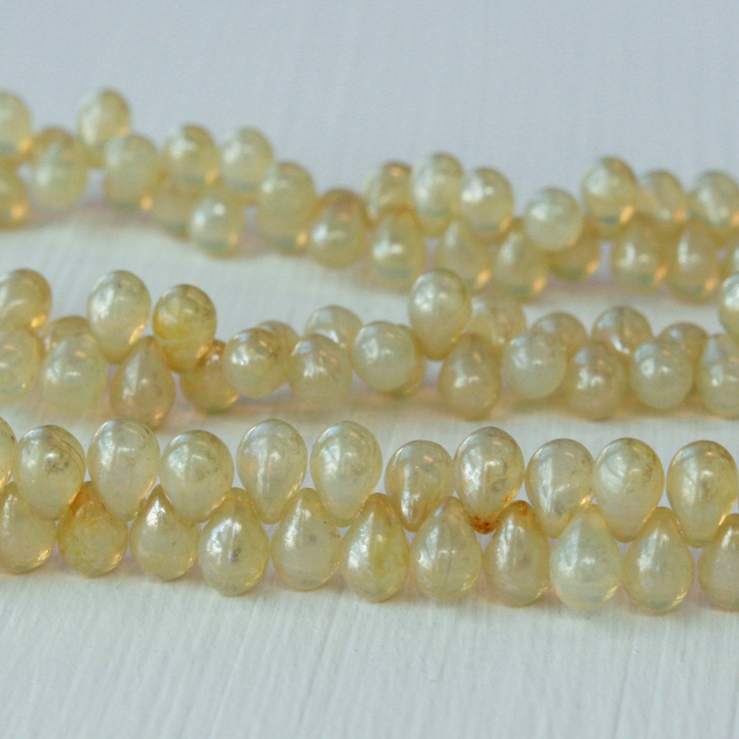 Load image into Gallery viewer, 6x9mm Glass Teardrop Beads - Ivory Champagne - 50 Beads
