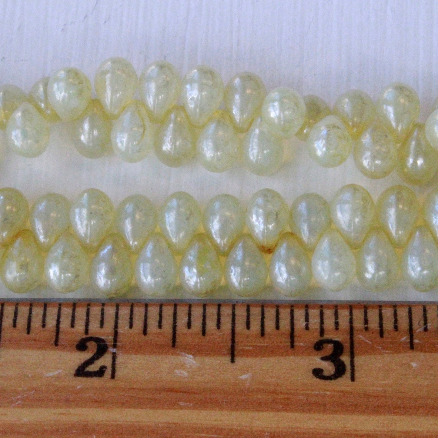 Load image into Gallery viewer, 6x9mm Glass Teardrop Beads - Ivory Champagne - 50 Beads
