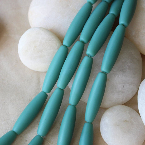 Load image into Gallery viewer, 8x30mm Frosted Glass Tapered Tube Beads - Opaque Teal - 14 Beads
