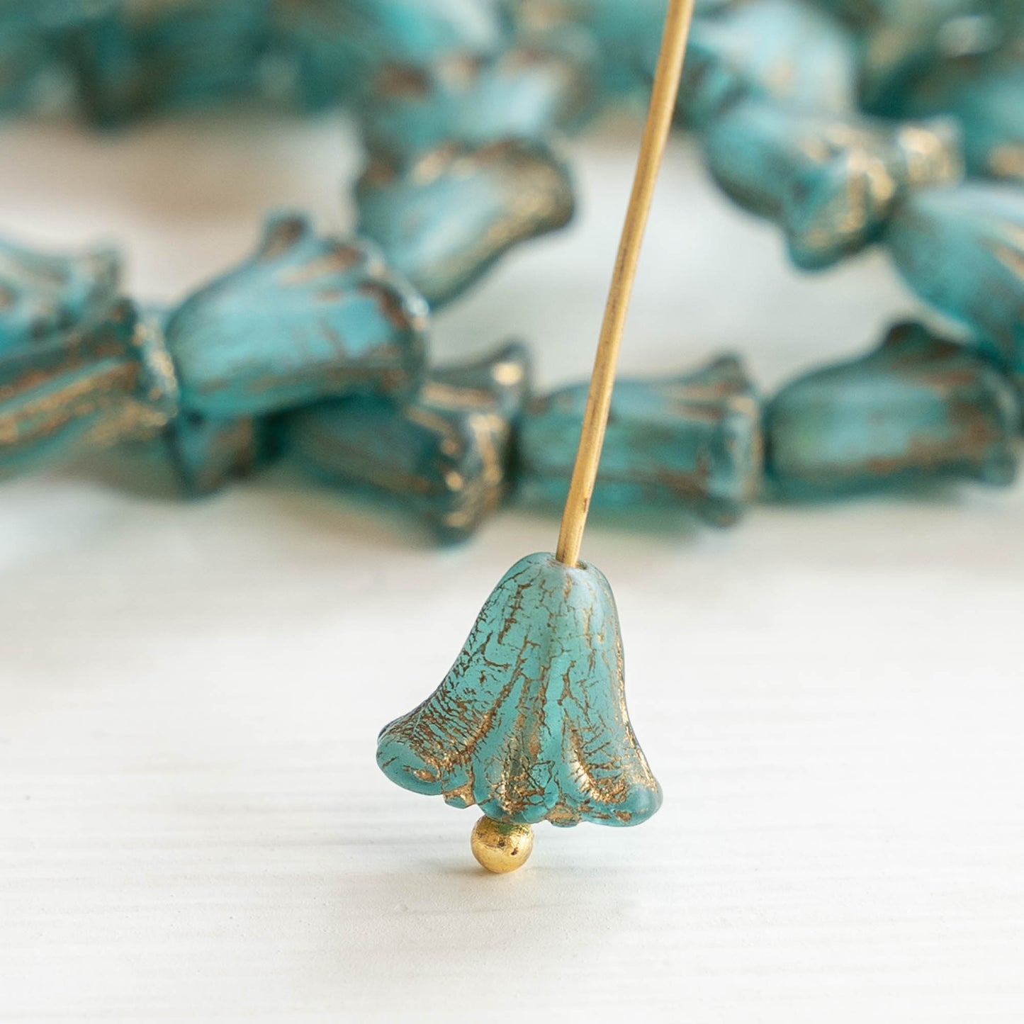 Load image into Gallery viewer, 9x10mm Lily Flower Beads - Aqua with Gold Wash - 15 Beads
