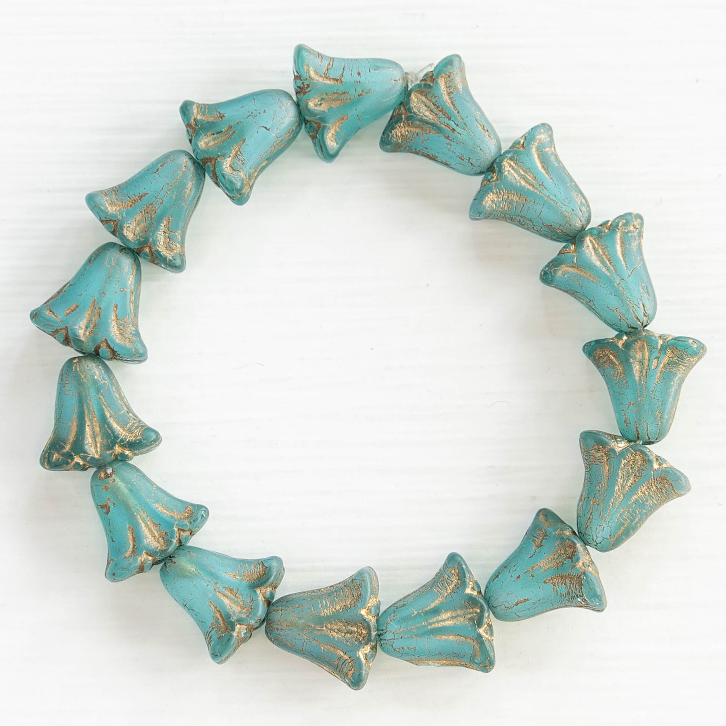 Load image into Gallery viewer, 9x10mm Lily Flower Beads - Aqua with Gold Wash - 15 Beads

