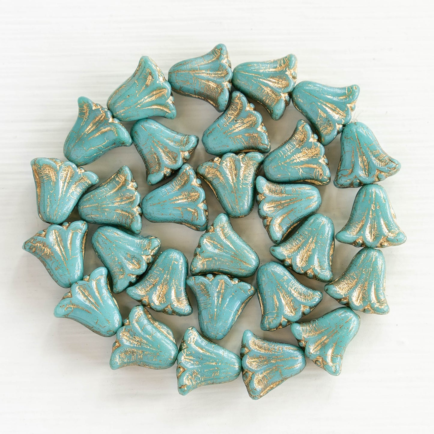Load image into Gallery viewer, 9x10mm Lily Flower Beads - Turquoise with Gold Wash - 15 Beads

