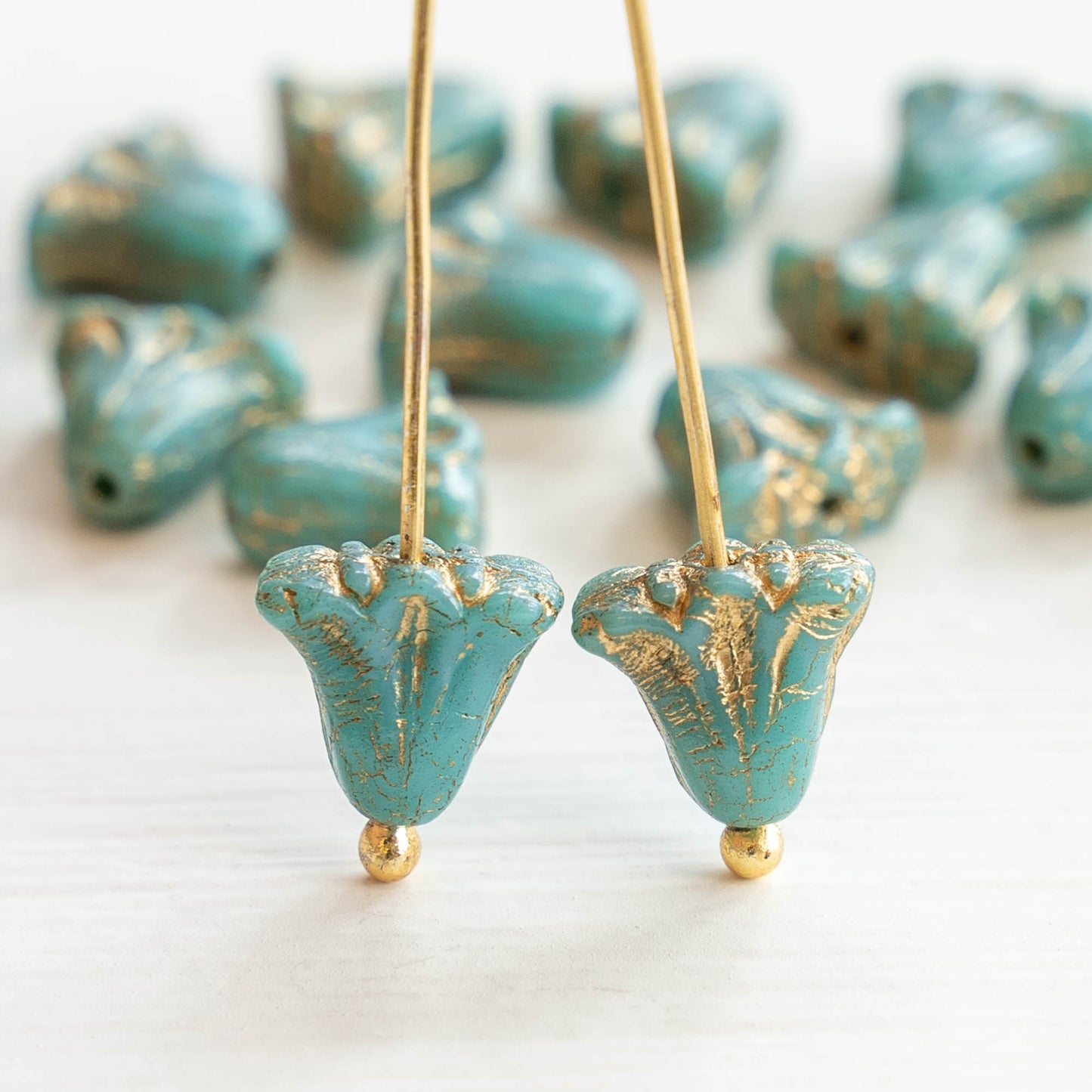 Load image into Gallery viewer, 9x10mm Lily Flower Beads - Turquoise with Gold Wash - 15 Beads
