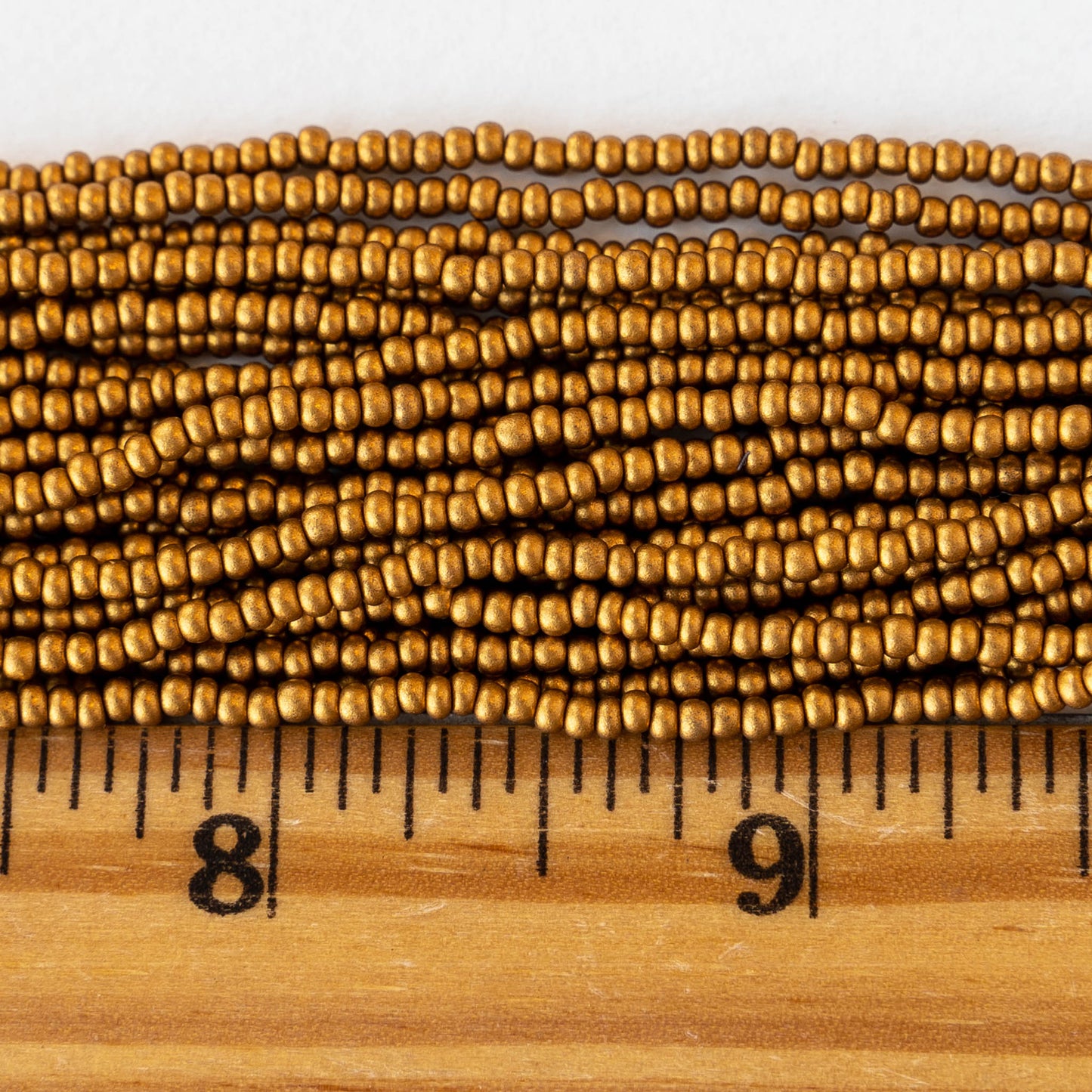Load image into Gallery viewer, 11/0 Glass Seed Beads - Antique Matte Gold - 6 Strands
