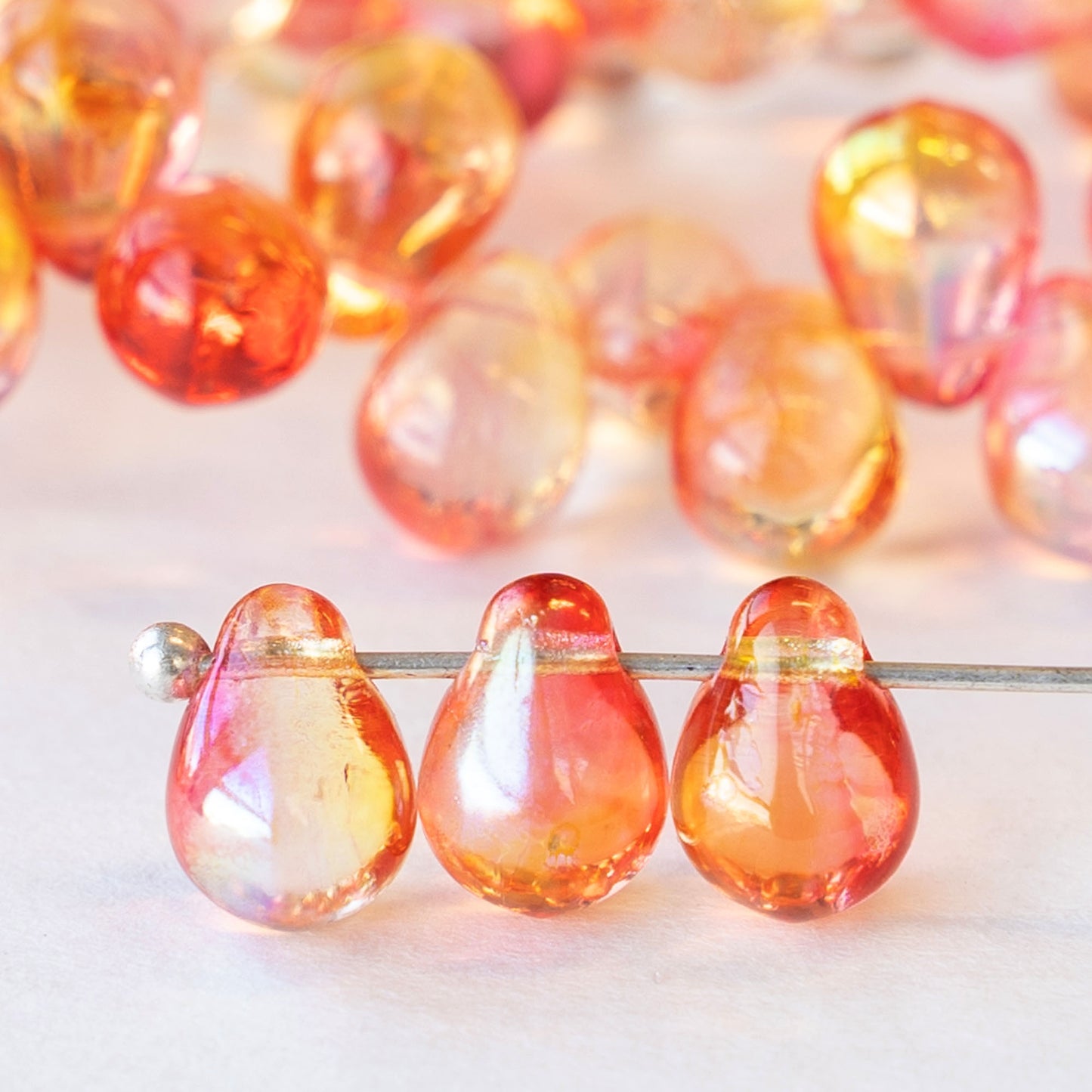 Load image into Gallery viewer, 6x8mm Glass Teardrop Beads - Light Pinky Orange Luster - 50 Beads
