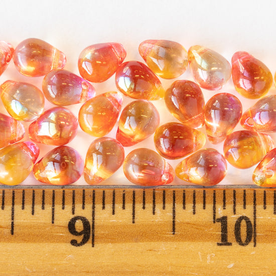 Load image into Gallery viewer, 6x8mm Glass Teardrop Beads - Light Pinky Orange Luster - 50 Beads
