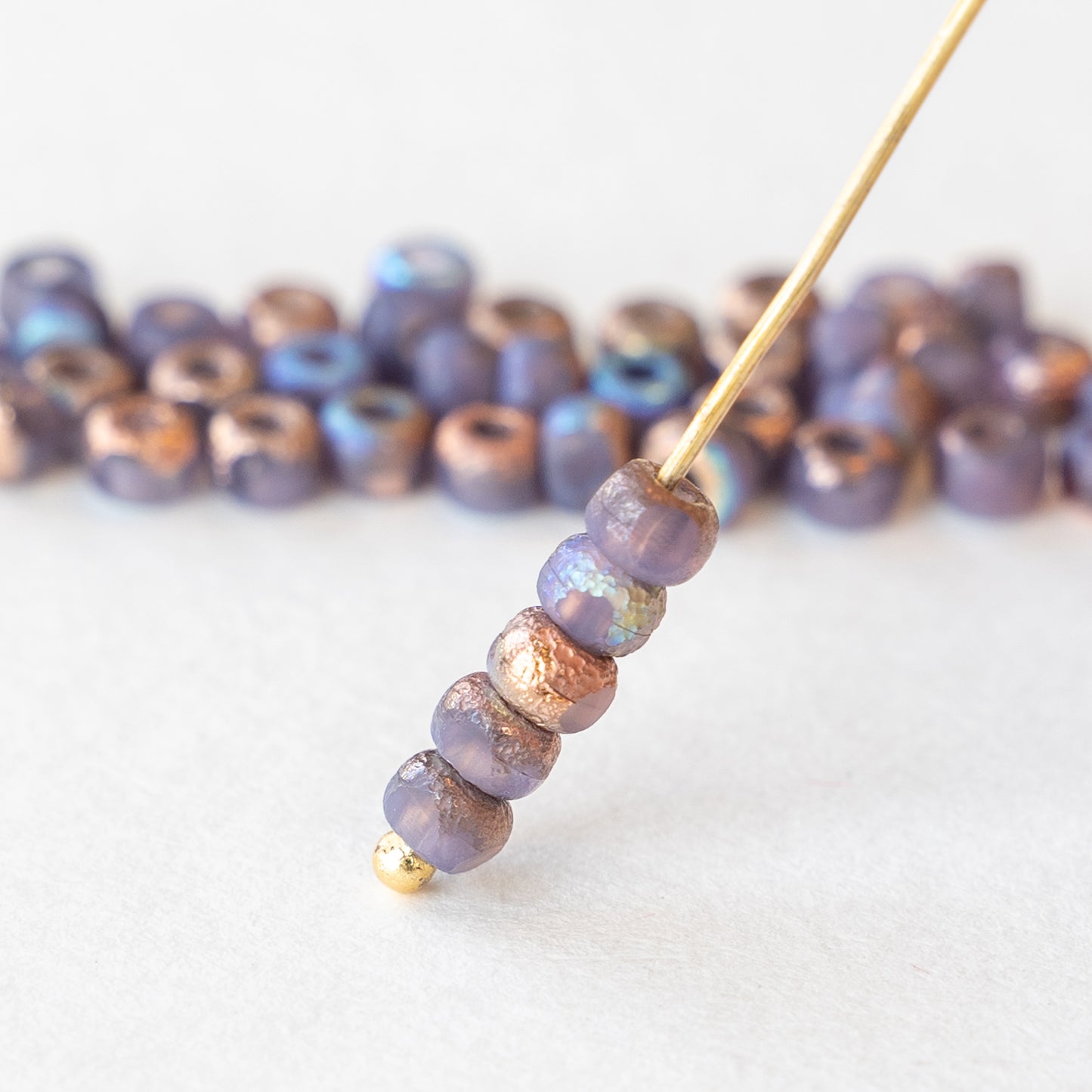 Load image into Gallery viewer, 6/0 Tri-cut Seed Beads - Lavender with Etched Bronze - 50
